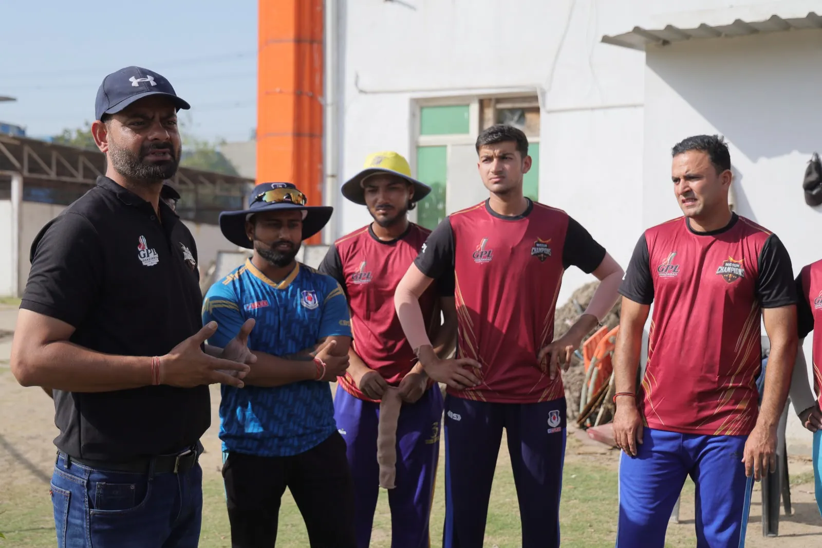 Migsun Champions squad in a team briefing at the HLM cricket ground