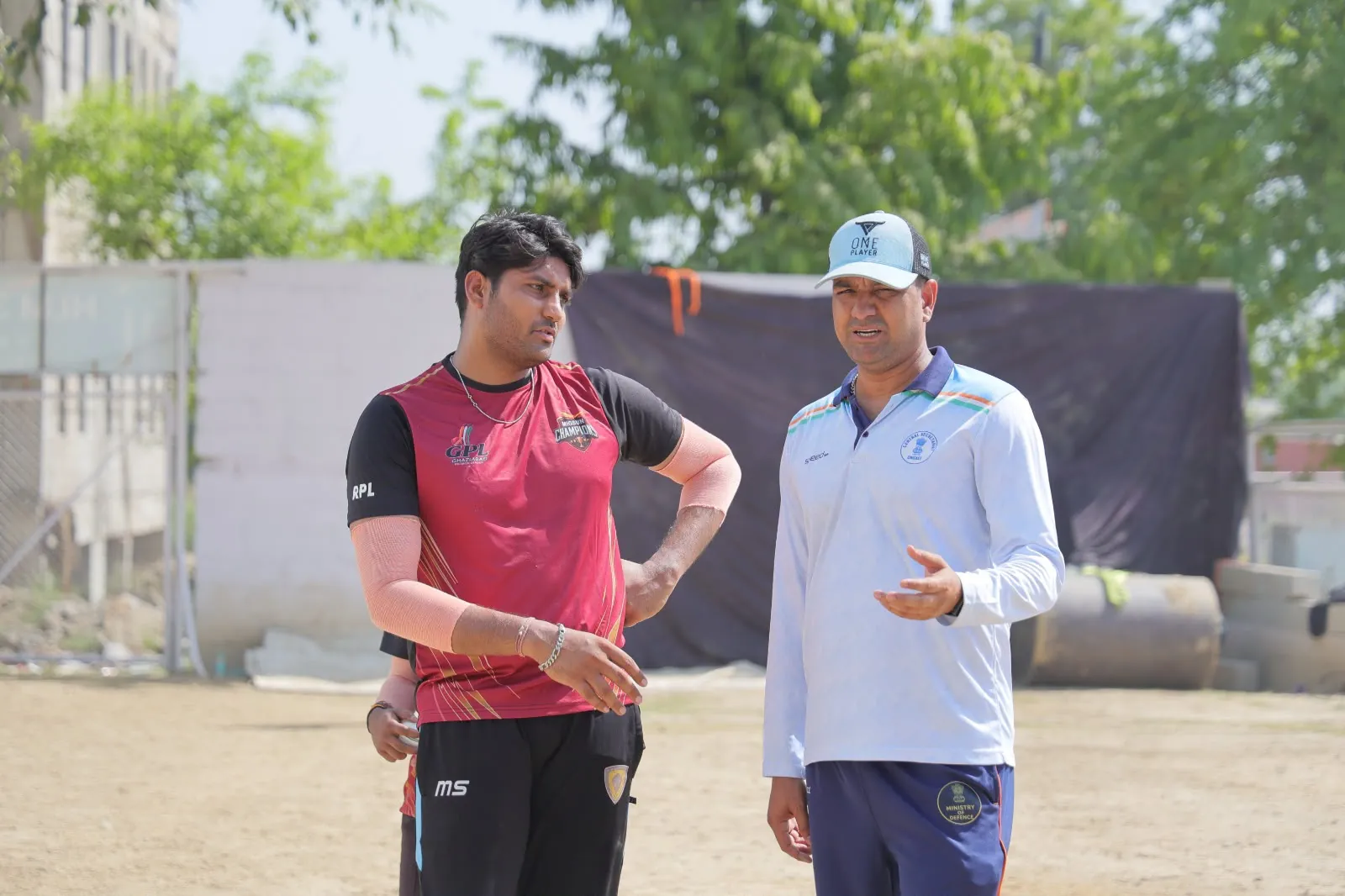 GPL player and coach in a strategy discussion at HLM campus ground